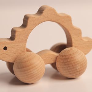 צעצוע דינוזאור על גלגלים